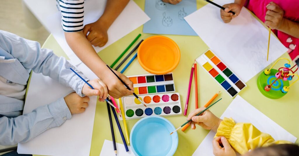 Kids enjoying watercolor painting indoors, fostering creativity and learning.